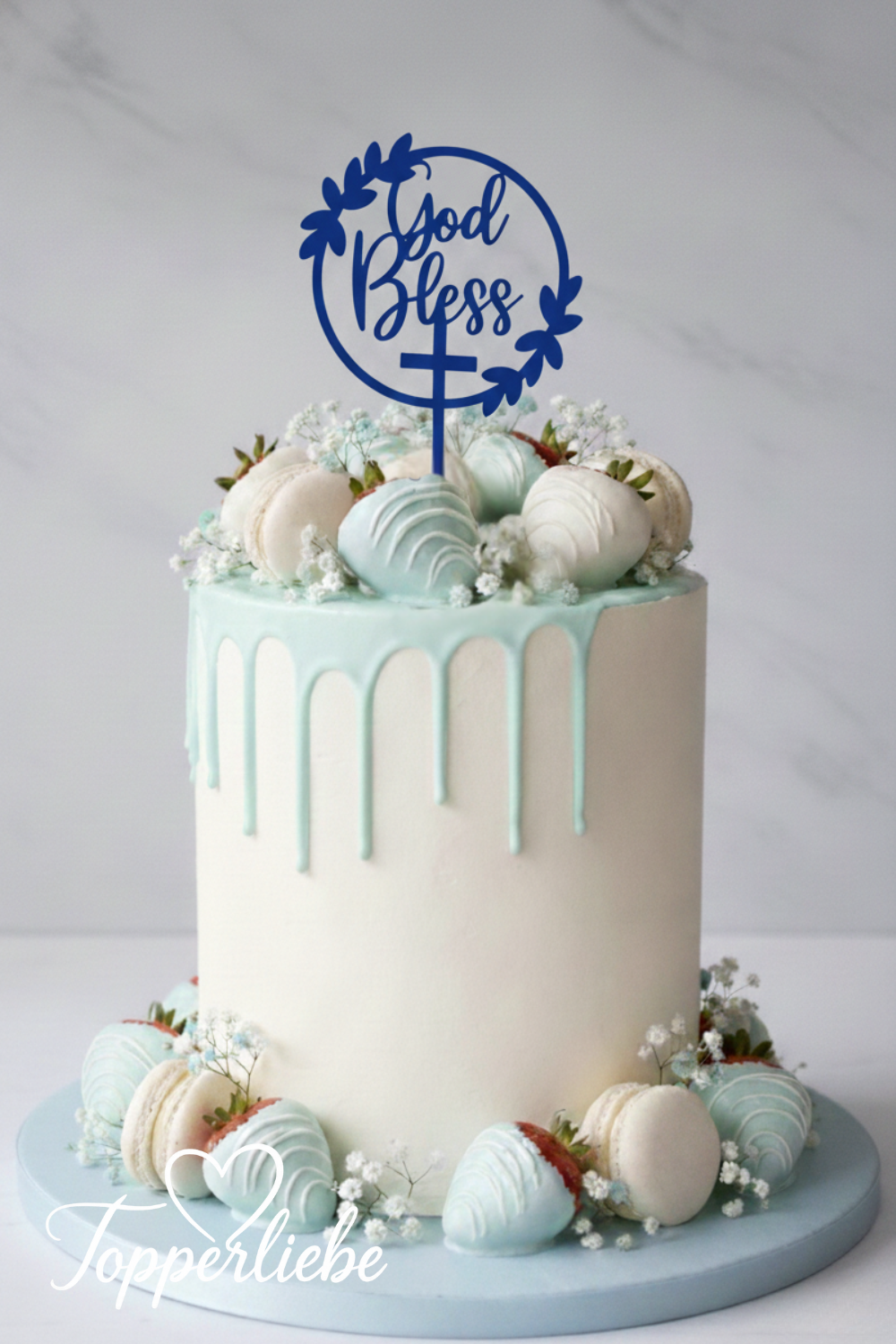 Blauer Cake Topper „God Bless“ mit Kreuz auf heller Torte, christliche Tortendekoration zur Taufe